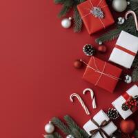 Festive Christmas Gifts and Ornaments on Red Background With Pine and Candy Canes photo