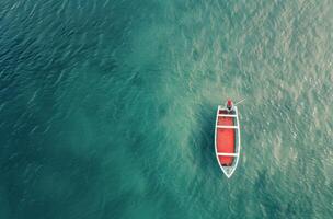 Aerial View of a Boat Near Divers in Crystal Clear Tropical Waters photo