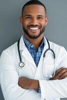 Smiling doctor in a lab coat with stethoscope against a gray background photo