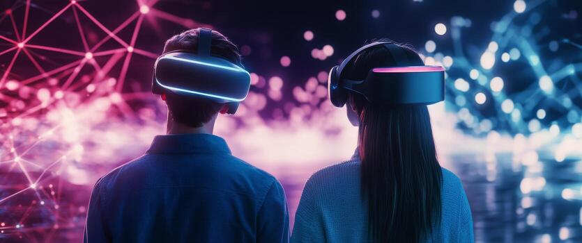 Two individuals exploring virtual reality in a vibrant digital environment at night photo