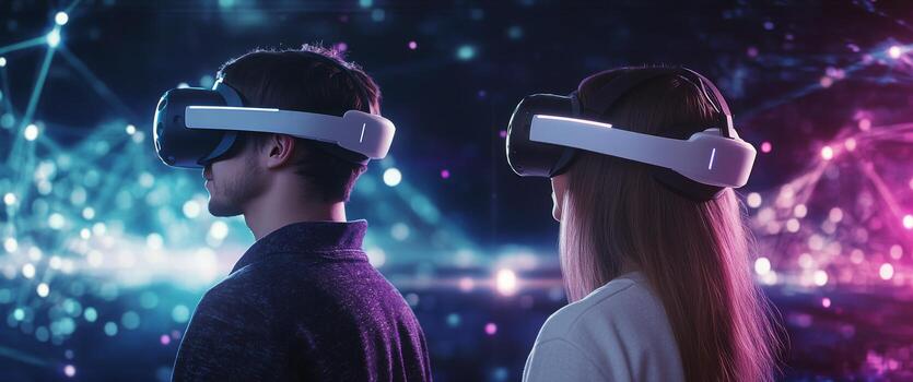Two individuals exploring virtual reality in a vibrant digital environment at night photo