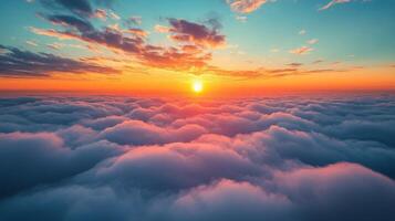 Vibrant sunset above fluffy clouds seen from a high vantage point photo