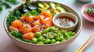 Fresh salmon and greens in a vibrant bowl with sesame dressing photo