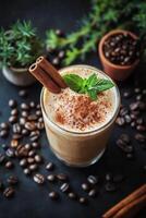 Iced coffee drinks with cinnamon garnish and coffee beans on a dark background photo