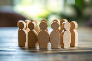 A circle formed by wooden human figures serves as a powerful symbol of teamwork, unity, and the spirit of community, emphasizing the importance of collaboration and togetherness among individuals photo