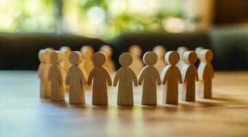 A crafted circle of interconnected wooden figures embodies teamwork, unity, and community. This artwork symbolizes the importance of collaboration and reminds us of our strength in working together photo