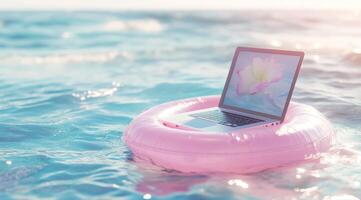 A colorful image shows a sleek laptop on a pink float in calm waters, symbolizing the balance modern professionals must find between work and leisure, reminding them to enjoy personal time photo