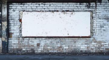An empty white board set against a distressed brick wall creates the perfect canvas for adding messages, artwork, or advertisements. This setup is ideal for various creative projects and expressions photo