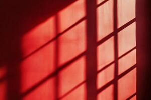 A captivating play of light is gracefully casting intricate red shadows while creating a warm and artistic ambiance photo