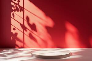 A minimalist scene with a circular base against a rich red wall, enhanced by subtle shadows adding depth photo