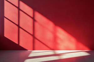 A stunning view of elongated shadows on a vibrant red wall, showcasing a remarkable interplay of light and color photo