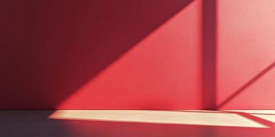 A strikingly bold red wall casting angular shadows that evoke modern design aesthetics and creativity photo