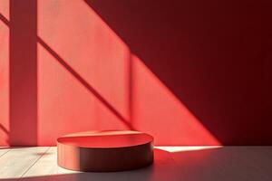 A striking red wall paired with a circular platform effectively creates a bold and captivating minimalist aesthetic photo