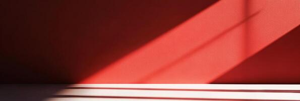 An abstract play of shadows and light dances on a bold red wall, creating captivating visual interest and allure photo