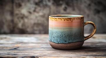 This beautiful ceramic coffee cup showcases a range of earthy tones and a visually appealing gradient design, making it ideal for savoring both hot and cold beverages in style and utmost comfort photo