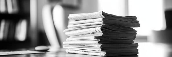 The image is a striking minimalist black and white photo showcasing a neatly arranged pile of documents, embodying organization and effective social media planning for any business