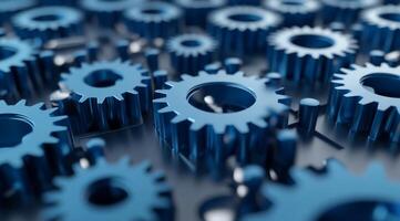 Delve into the captivating and intricate design of interlocked blue metal gears, which serve as a powerful symbol of teamwork and precision in the world of machinery and mechanical engineering photo