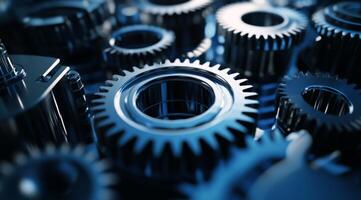 This image features interlocked blue metal gears, symbolizing teamwork and collaboration, while highlighting the complexity of industrial machinery crucial to the manufacturing process photo