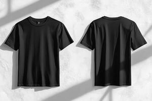 This minimalistic mockup of a stylish black tshirt is showcased against a clean white wall, displaying both front and back views, making it ideal for design and professional presentations photo