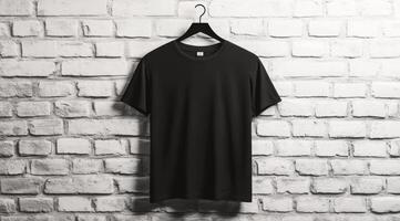 A sleek, stylish black tshirt is elegantly displayed on a hanger in front of a textured brick wall photo