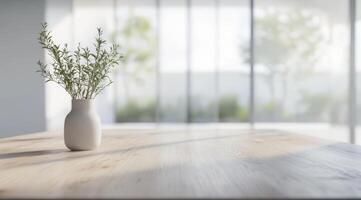 A soft focus reveals a Scandinavian interior with a minimalist table adorned by a graceful vase of greenery, creating a serene and inviting atmosphere that promotes relaxation and warmth photo