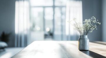A serene Scandinavian interior features a blurred background, showcasing a delicate vase of vibrant flowers on a rustic table, embodying minimalistic elegance and creating a warm, inviting atmosphere photo