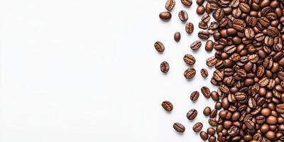 This attractive collection of randomly placed coffee beans on a pristine white backdrop beautifully highlights a range of coffeerelated themes that a diverse audience can truly appreciate and enjoy photo