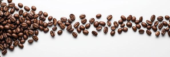 This is a beautifully arranged collection of coffee beans that are scattered around a blank space, which is perfect for incorporating a warm coffee theme into your creative designs or presentations photo