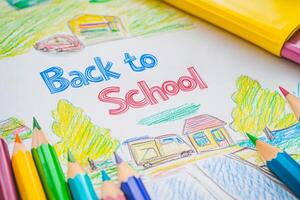 A vibrant Back to School drawing, surrounded by colorful pencils, symbolizes the exciting start of a new school year, full of opportunities for learning, exploration, and personal growth photo