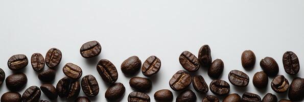 A visually appealing arrangement of roasted coffee beans scattered elegantly around a spacious copy space, ideal for coffee lovers and brands photo
