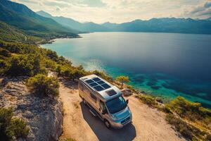 Embark on an unforgettable adventure as you explore a breathtakingly scenic location in a solarequipped campervan, which is perfect for sustainable travel and offers exciting outdoor experiences photo