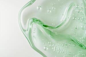 Here we have an intricate and stunning closeup image of a vibrant green serum, which showcases its unique bubbly texture, making it the perfect choice for various skincare and wellness products photo