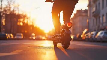 A person rides an electric scooter down a busy city street at sunset, showcasing the joys of ecofriendly commuting, which is more sustainable and efficient than traditional methods photo