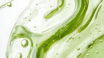 This vibrant closeup highlights a green serum with tiny bubbles and a smooth texture, emphasizing the importance of natural skincare in enhancing our overall wellbeing and health photo