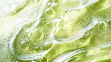 A captivating macro photo showcases a vibrant green serum filled with bubbles that highlight its smooth texture. This serum enhances skincare, offering fresh hydration and a radiant glow