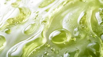This closeup shows a vibrant green serum with droplets that highlight its organic properties, making it ideal for skincare routines and enhancing overall wellness and health benefits photo