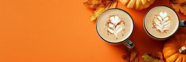 Savor the seasonal delight of pumpkin lattes surrounded by autumn leaves and pumpkins, perfect for cozy October days photo