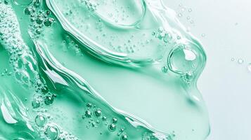 This closeup image of a vibrant green serum highlights its unique bubbly texture, showcasing a blend of natural ingredients crafted for optimal skin health, nourishment, and wellness photo