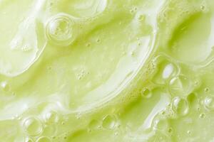 This macro view of a vibrant green serum emphasizes its exceptionally smooth texture and tiny bubbles, which together symbolize a deep sense of wellness and the essence of natural skincare photo