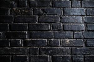 A closeup image of a textured black brick wall, beautifully showcasing minimalism with its unique abstract patterns and dramatic interplay of light and shadows that create depth and interest photo
