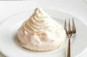 Meringue cake with whipped cream photo