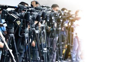 Many reporters and cameras, white background. photo