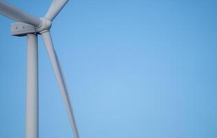 Wind energy and sustainable power generation with wind turbines, Eco-friendly solutions for renewable resources. Wind power farm and sustainable development of renewable energy, green technology. photo