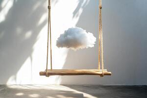 Empty swing made of hemp rope and wood with a cloud suspended in the air, backdrops, product presentation photo