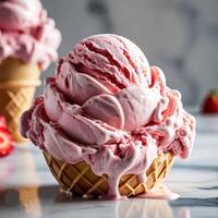 Freshly Made Pink Ice Cream in Waffle Cones on a Marble Countertop photo
