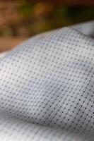 close up texture of jersey fabric with drop needle motif photo