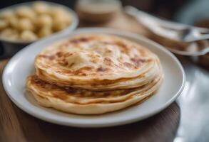 Two Golden-Brown Pancakes on a White Plate photo