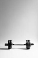 Dumbbell on light background, minimalistic fitness concept, photo