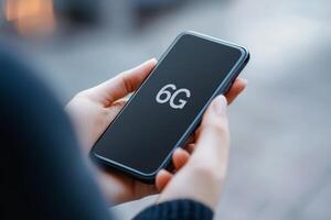 Hand holding smartphone with 6G technology concept photo