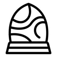 Easter egg decorated with wavy lines standing on a stand icon vector